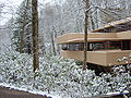Winter picture of south end of Fallingwater house from driveway approach